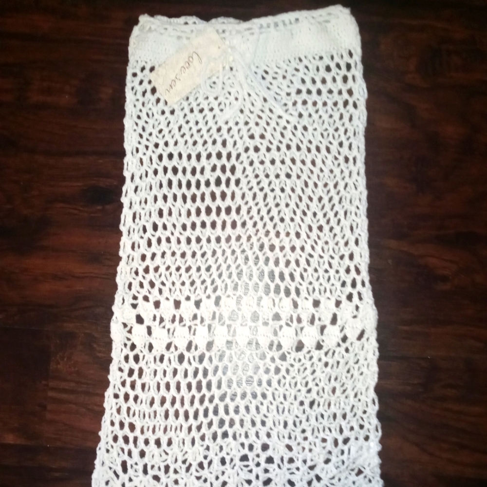 Over swimming suit and knitted dress